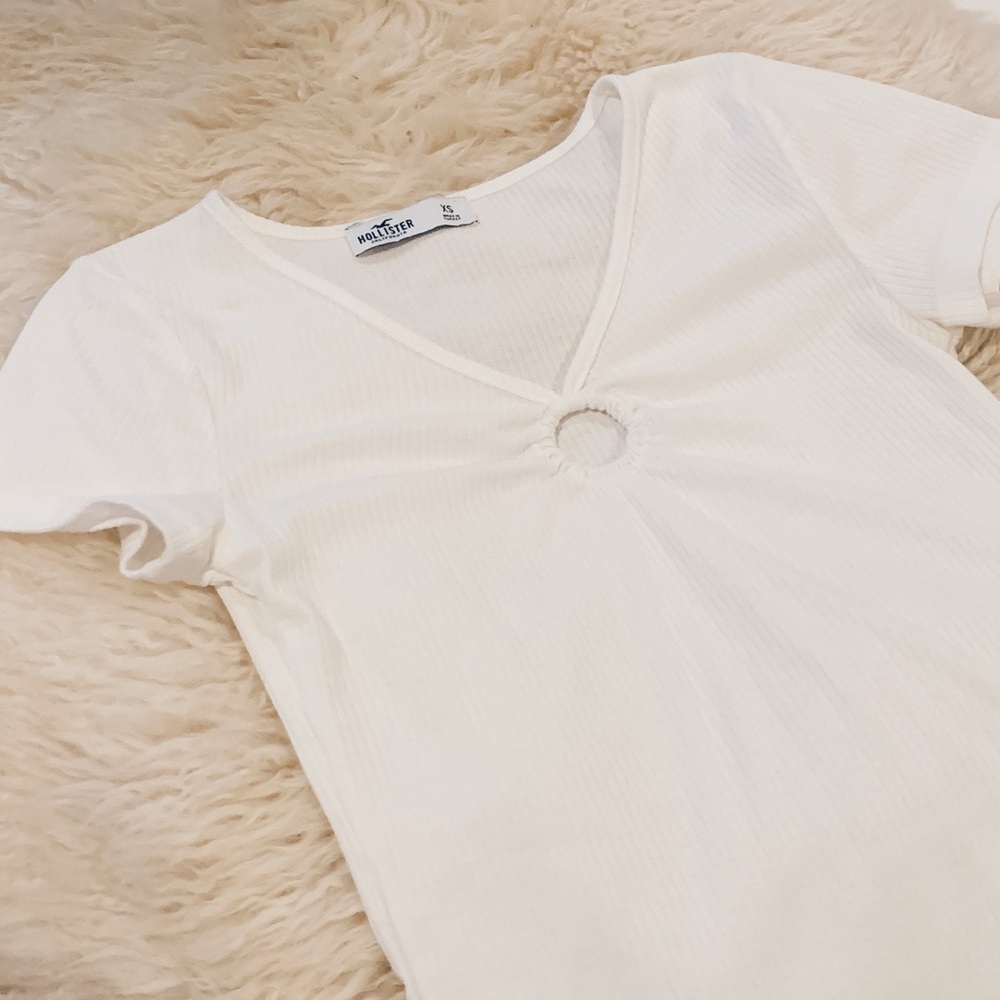 white top with ring hole